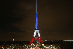 PARIS, FRANCE - NOVEMBER 16:  The Eiffel Tower is illuminated in Red, White and Blue in honour of the victims of Friday's terrorist attacks on November 16, 2015 in Paris, France. Countries across Europe joined France today to observe a one minute-silence in an expression of solidarity with the victims of the terrorist attacks, which left at least 129 people dead and hundreds more injured.  (Photo by Christopher Furlong/Getty Images)